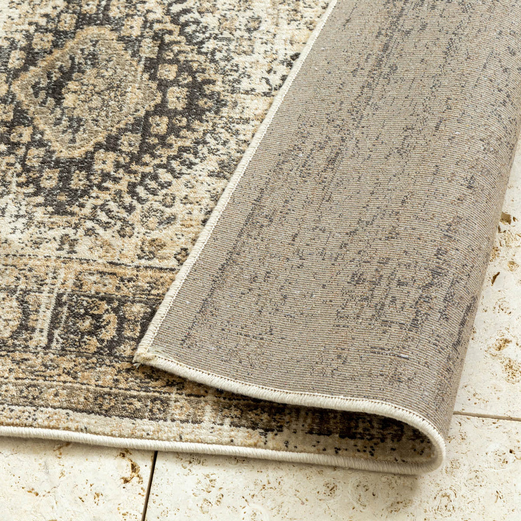 オリエンタルなダイヤ柄のパターンが美しいブラウンカラーのヴィンテージスタイルのラグの裏面