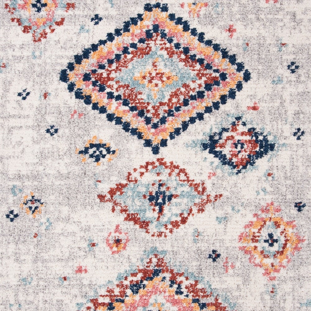 温かな色使いのダイヤモンドモチーフが、明るいトーンでお部屋に賑やかさをプラスしてくれるモロッカンラグの表面1